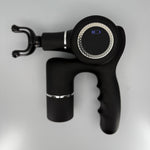 Black handheld massage gun on a light gray background